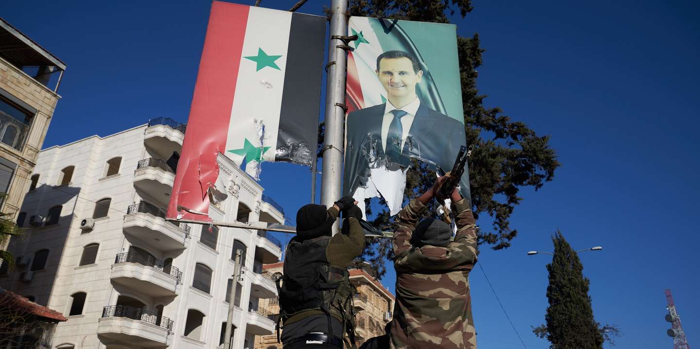 epa11750340 Syrian opposition fighters tear up a portrait of Syrian President Bashar al-Assad in central Aleppo, Syria, 30 November 2024. Syrian opposition forces have taken significant control of Aleppo, a major city and former economic hub of Syria, after intense battles with government forces. The offensive triggered Russian strikes on Aleppo 30 November 2024, the first since 2016, and saw Syria's military withdraw its troops from the city. The attack was led by the Islamist militant group Hayat Tahrir al-Sham (HTS).  EPA/KARAM AL-MASRI