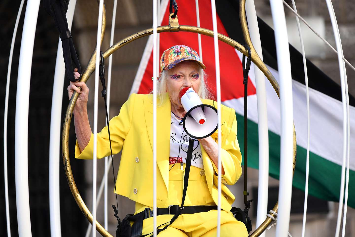 Dame Vivienne Westwood Suspends 10 Ft High Inside Giant Bird Cage In Protest For Julian Assange