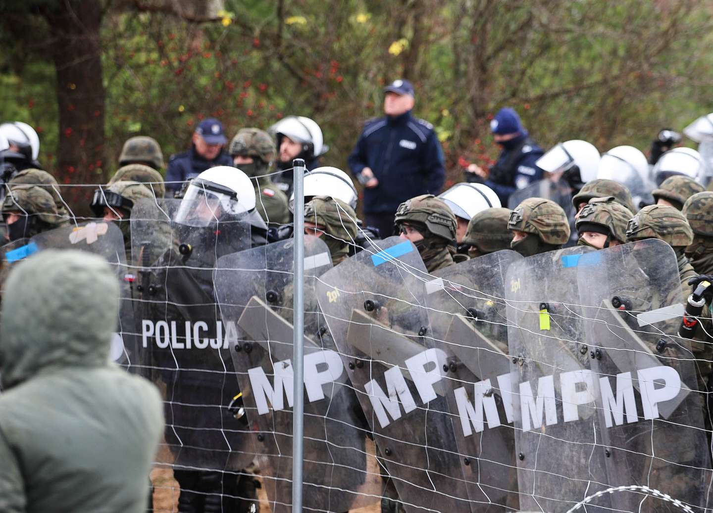 Migrantes encaminhados na fronteira Bielorrússia com a Polónia