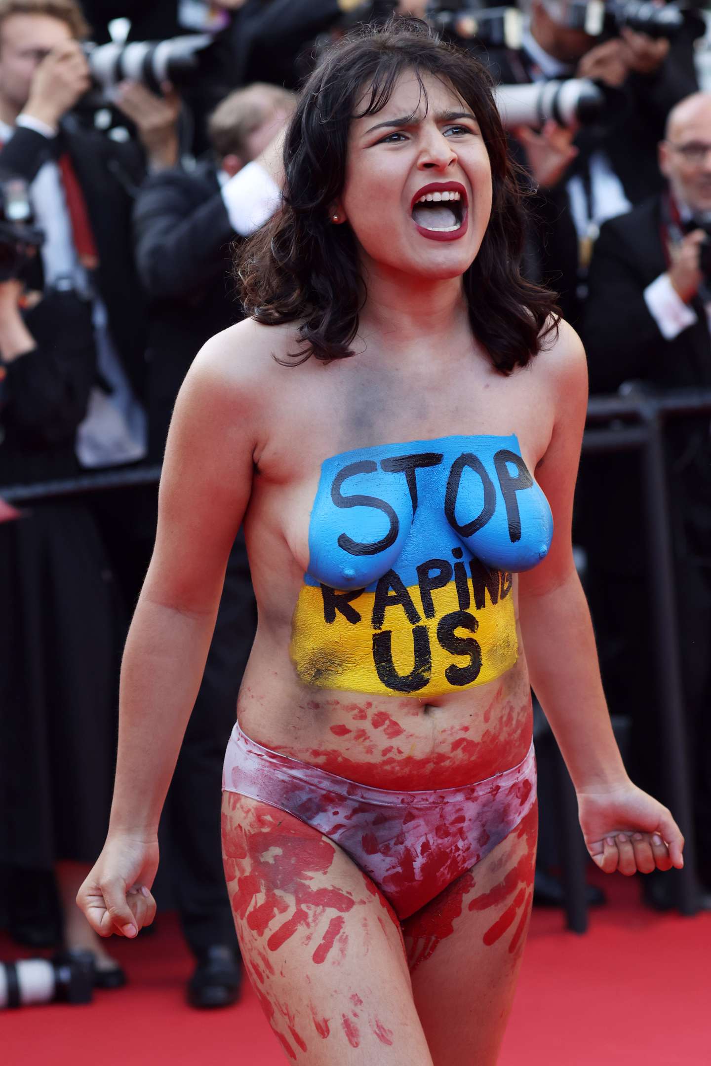 Protesters On The "Three Thousand Years Of Longing (Trois Mille Ans A T'Attendre)" Red Carpet - The 75th Annual Cannes Film Festival