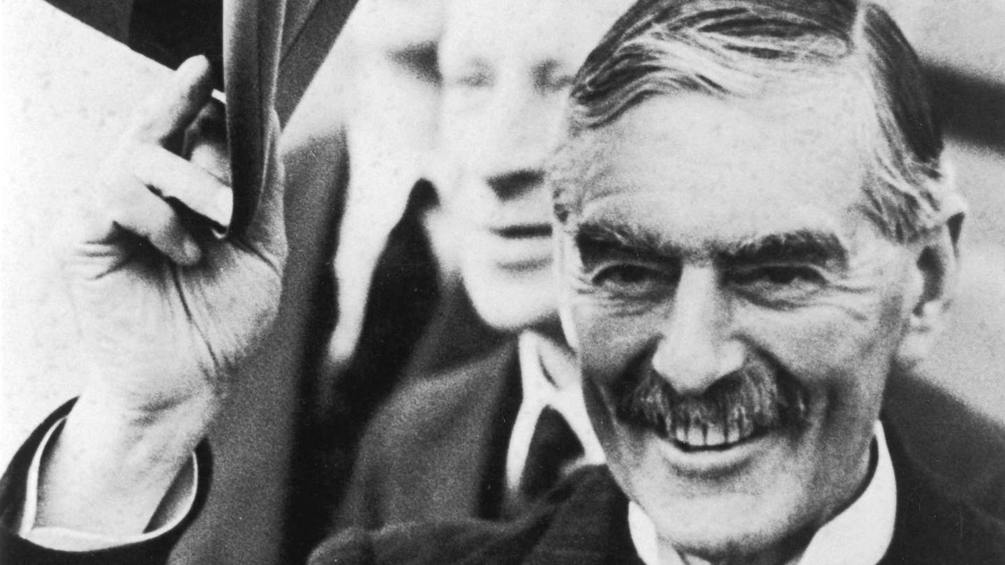 Prime Minister Neville Chamberlain (1869-1940) greeting crowds on return, 16 September 1938.