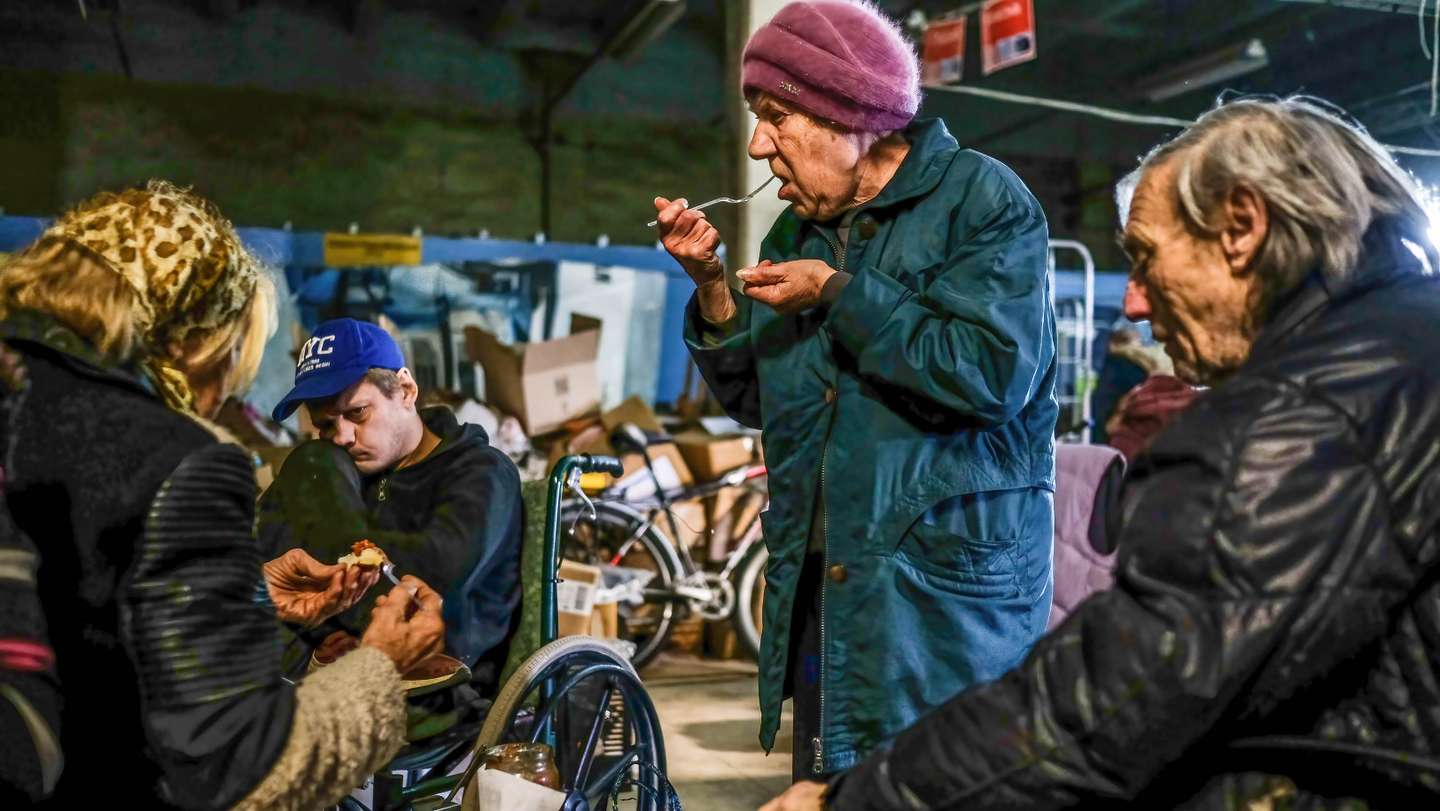 Civilians sheltering inside the center for distribution of