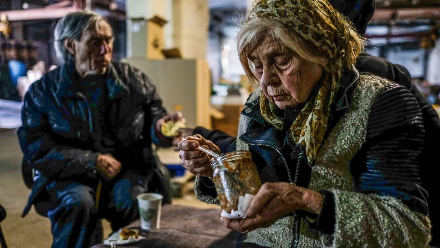 Civilians sheltering inside the center for distribution of