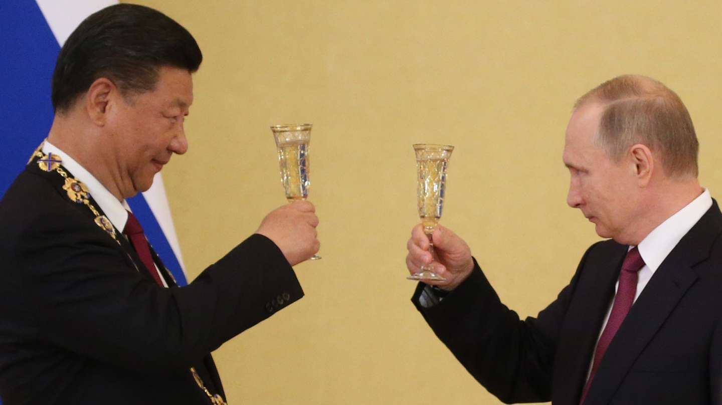 Russian President Vladimir Putin receives Chinese President Xi Jinping in Moscow