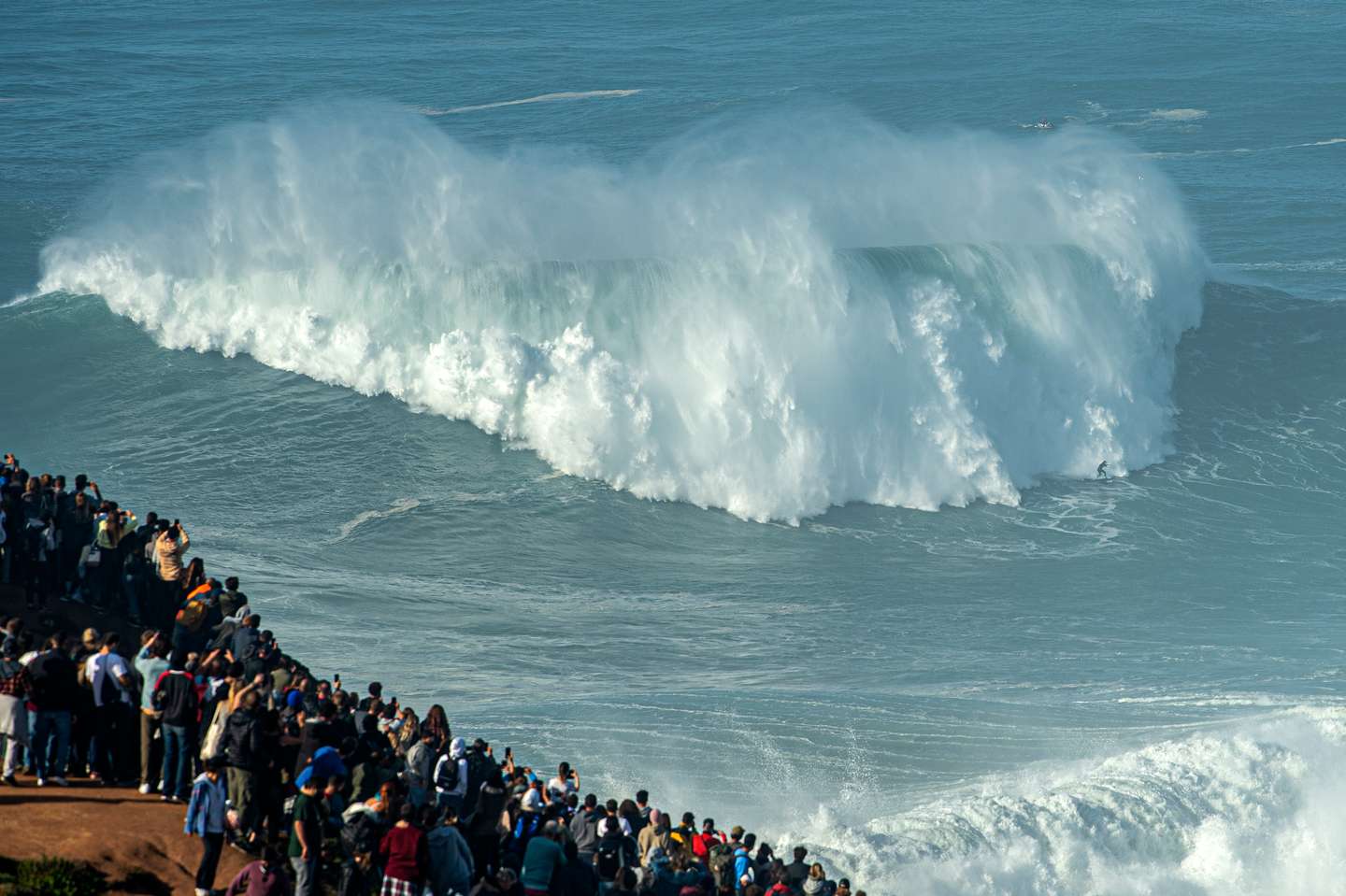 Surfers Ride The Nazare Big Waves