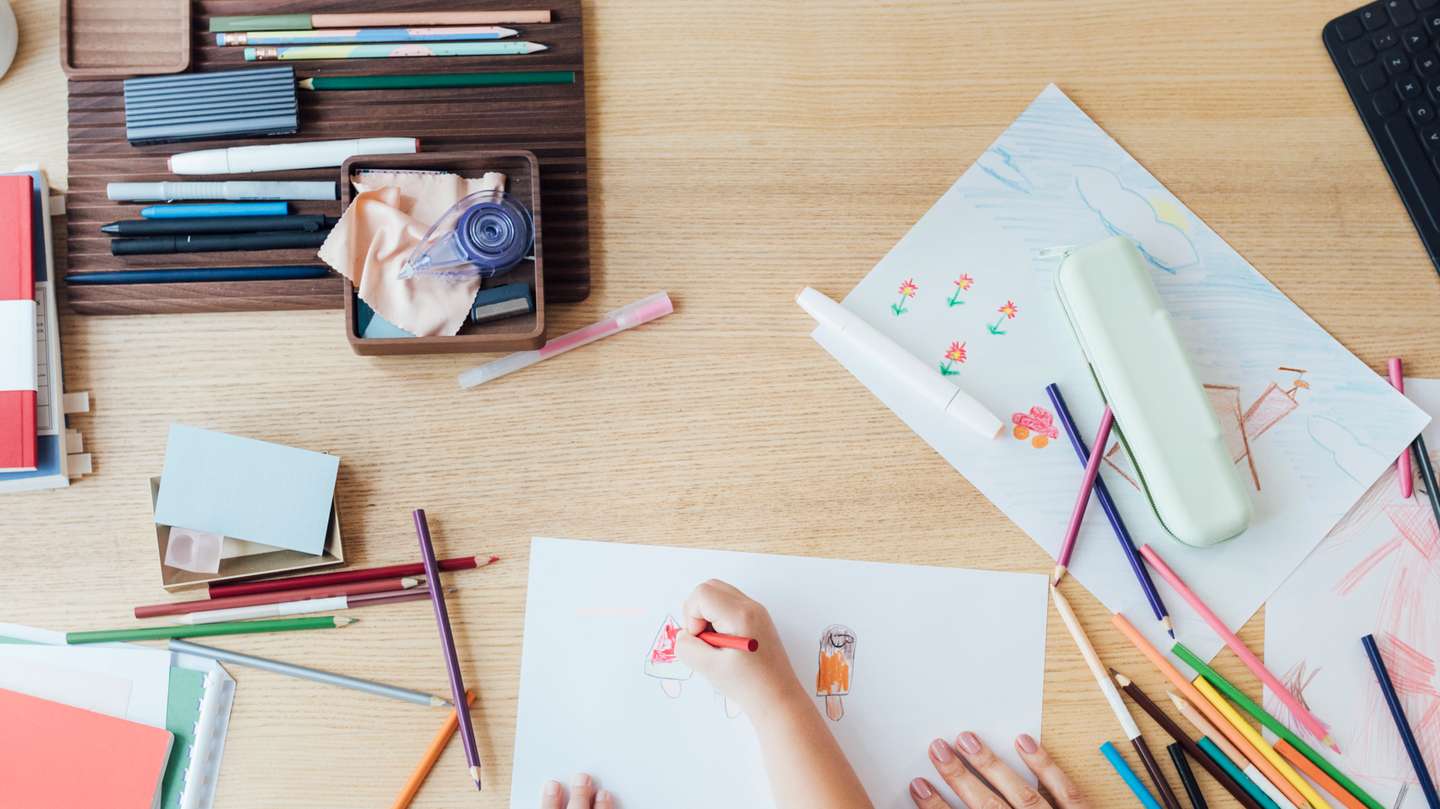 Homeschooling: Hands of an Unrecognizable Child Drawing While Sitting on her Mother's Lap, Lockdown Activities Concept (Overhead View)