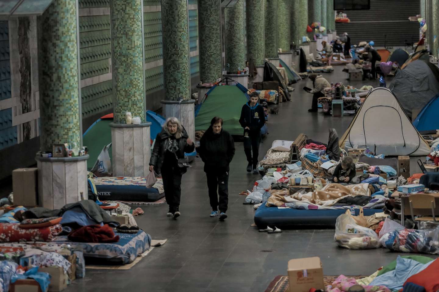 Ukrainians seen in the metro station after fleeing amid