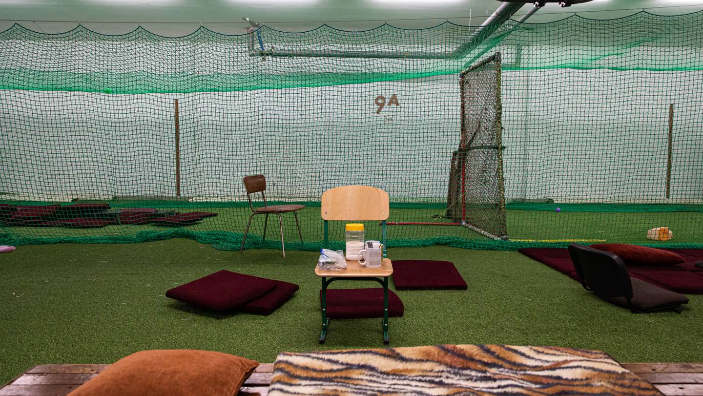 Chairs and blankets were placed in an underground sports