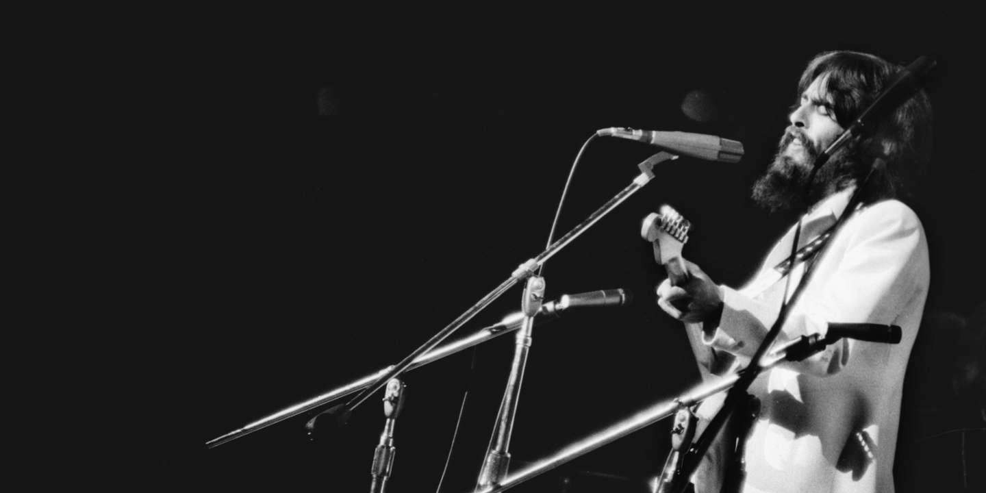 Portrait of George Harrison Performing in Concert