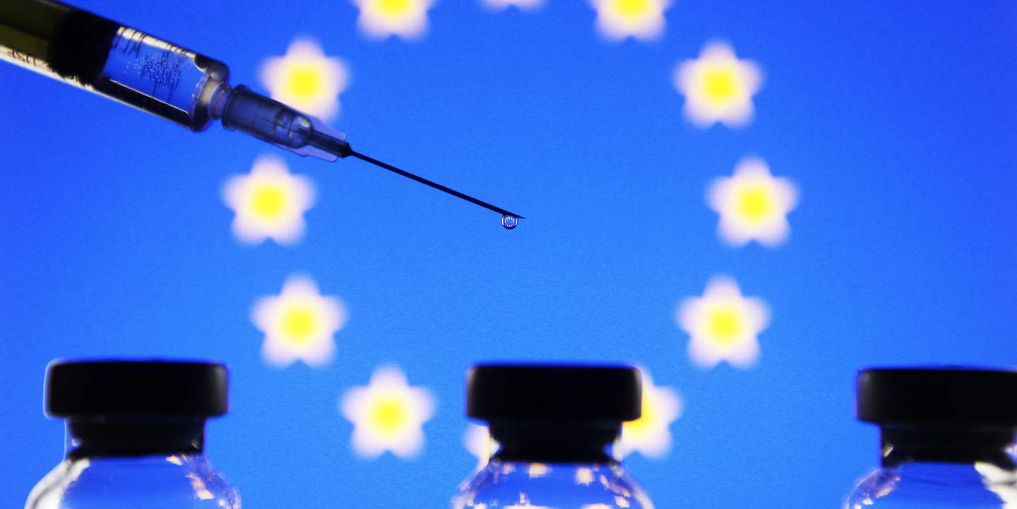In this photo illustration the vials and a medical syringe