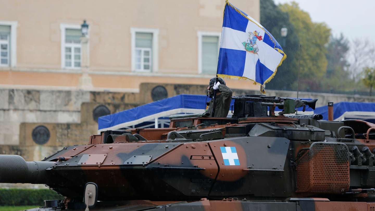 A soldier in a German Leopard 2 Main Battle Tank holds an