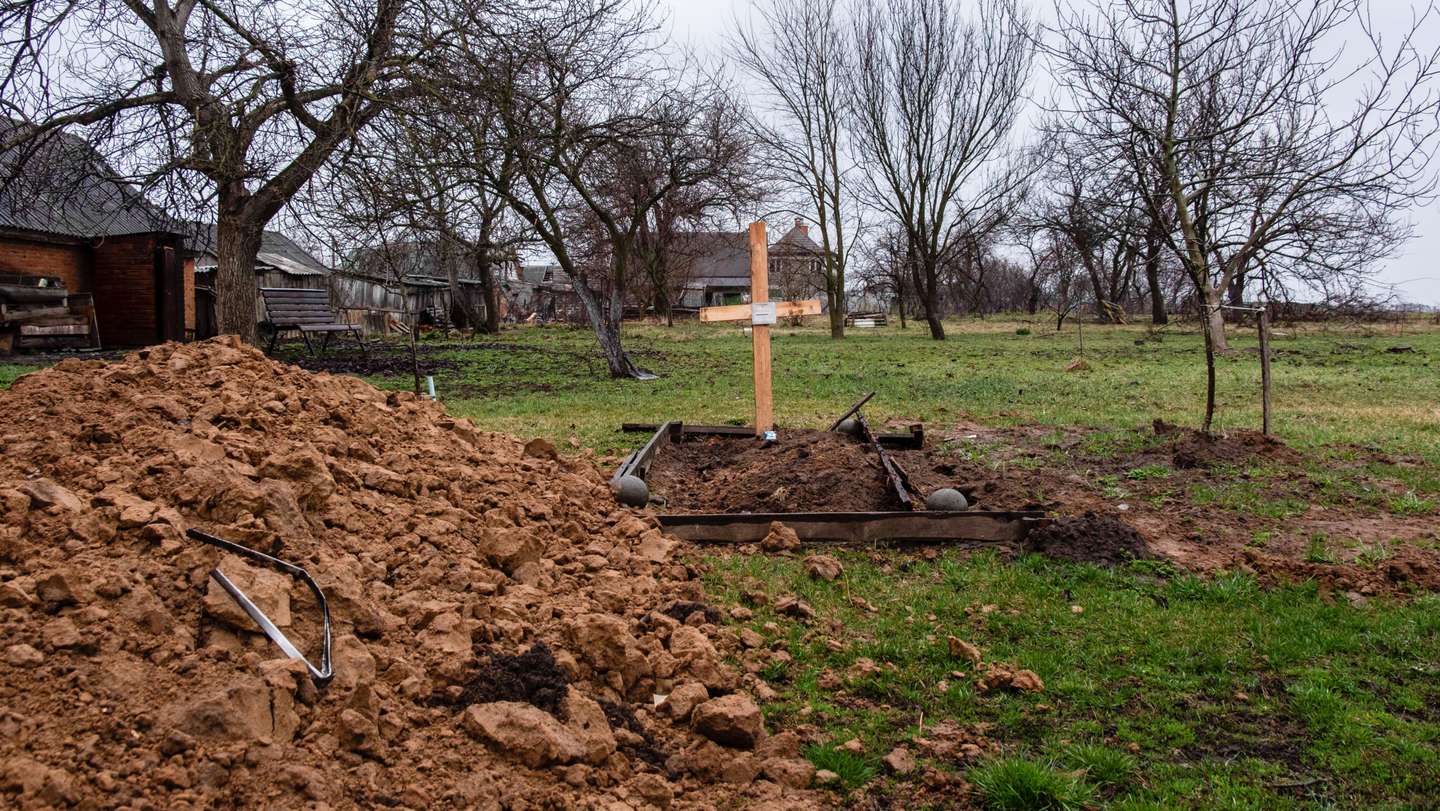 A grave of a civilian is buried in a family garden in
