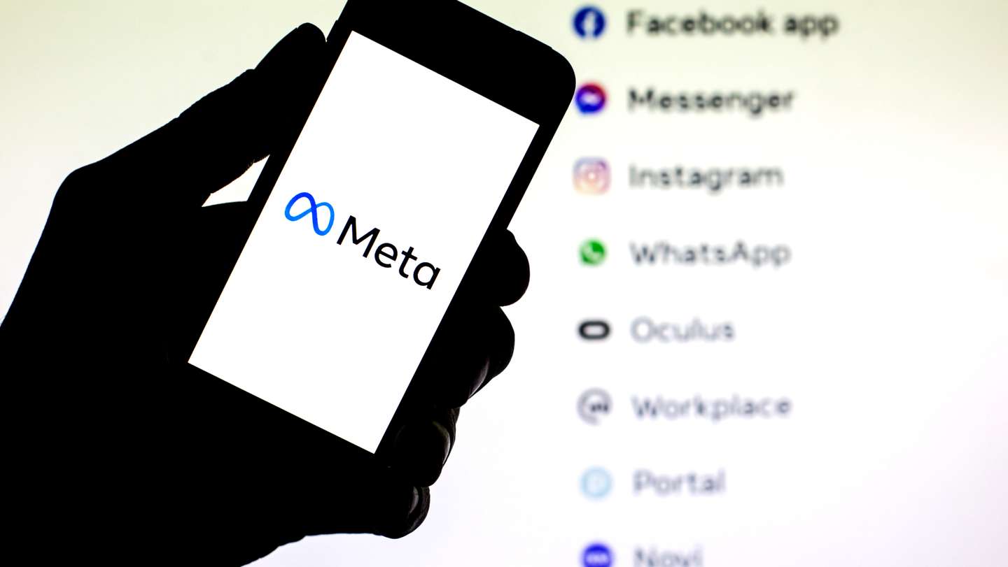 In this photo illustration a Meta logo seen displayed on a