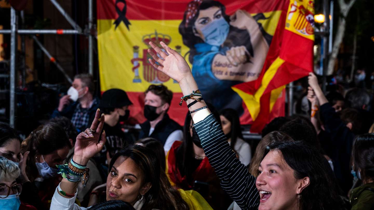 Supporters of Popular Party (PP) shouting as they follow the