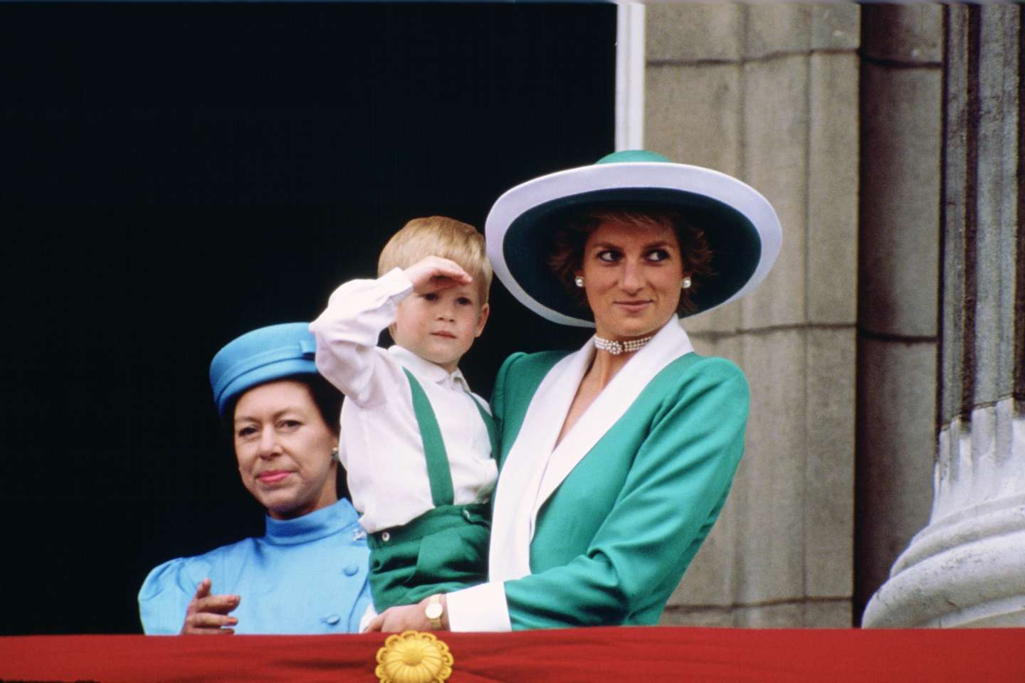 Diana, Princess of Wales, holding a young Prince Harry in he