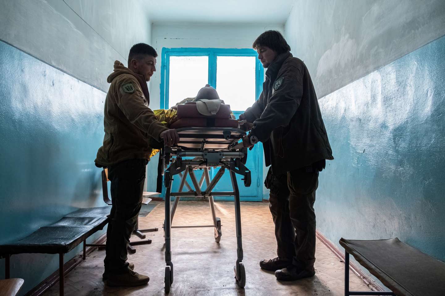 An injured soldier from the frontline arrived on a stretcher
