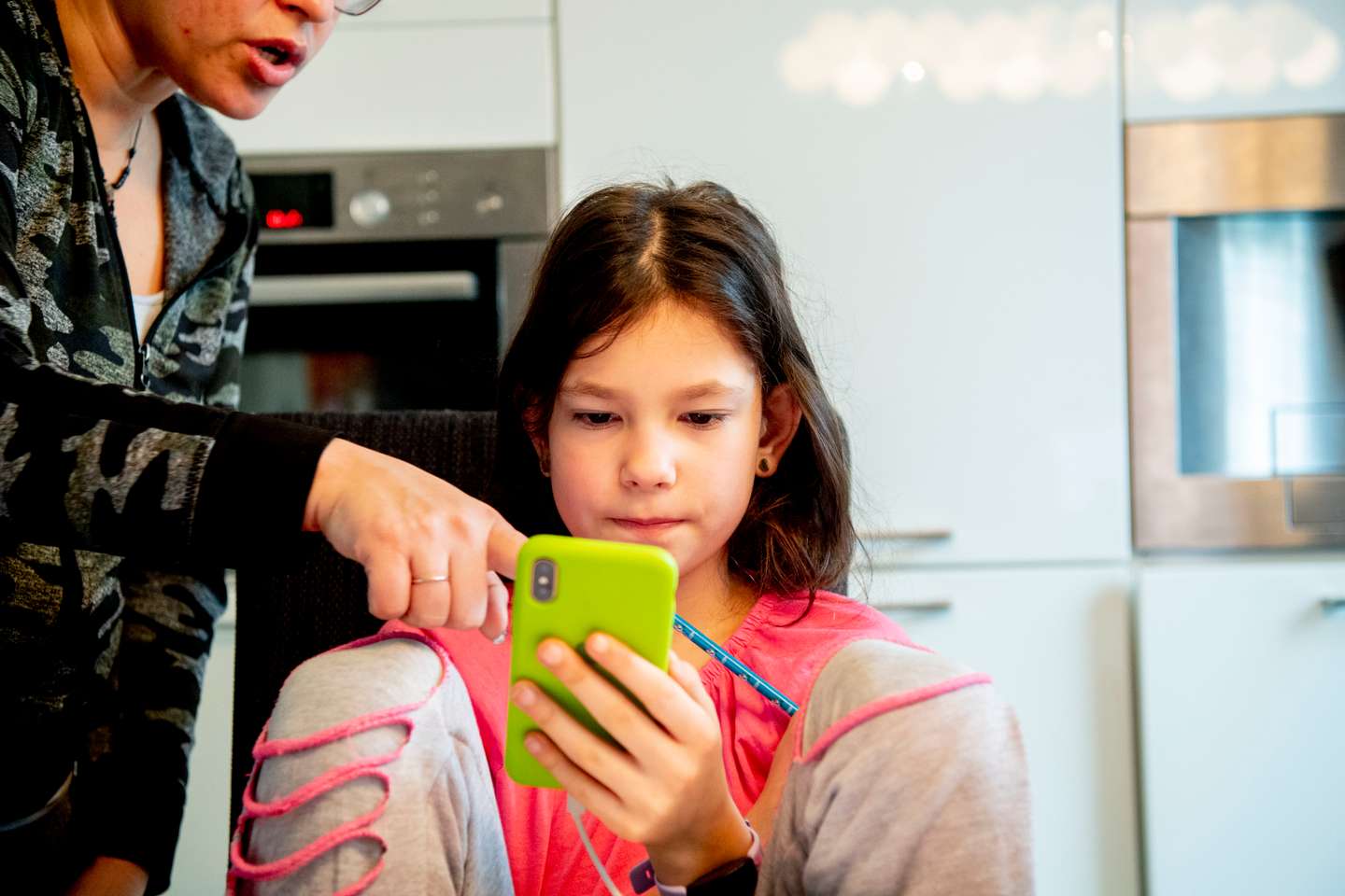 A 9 year old child gets digital school lessons at home with