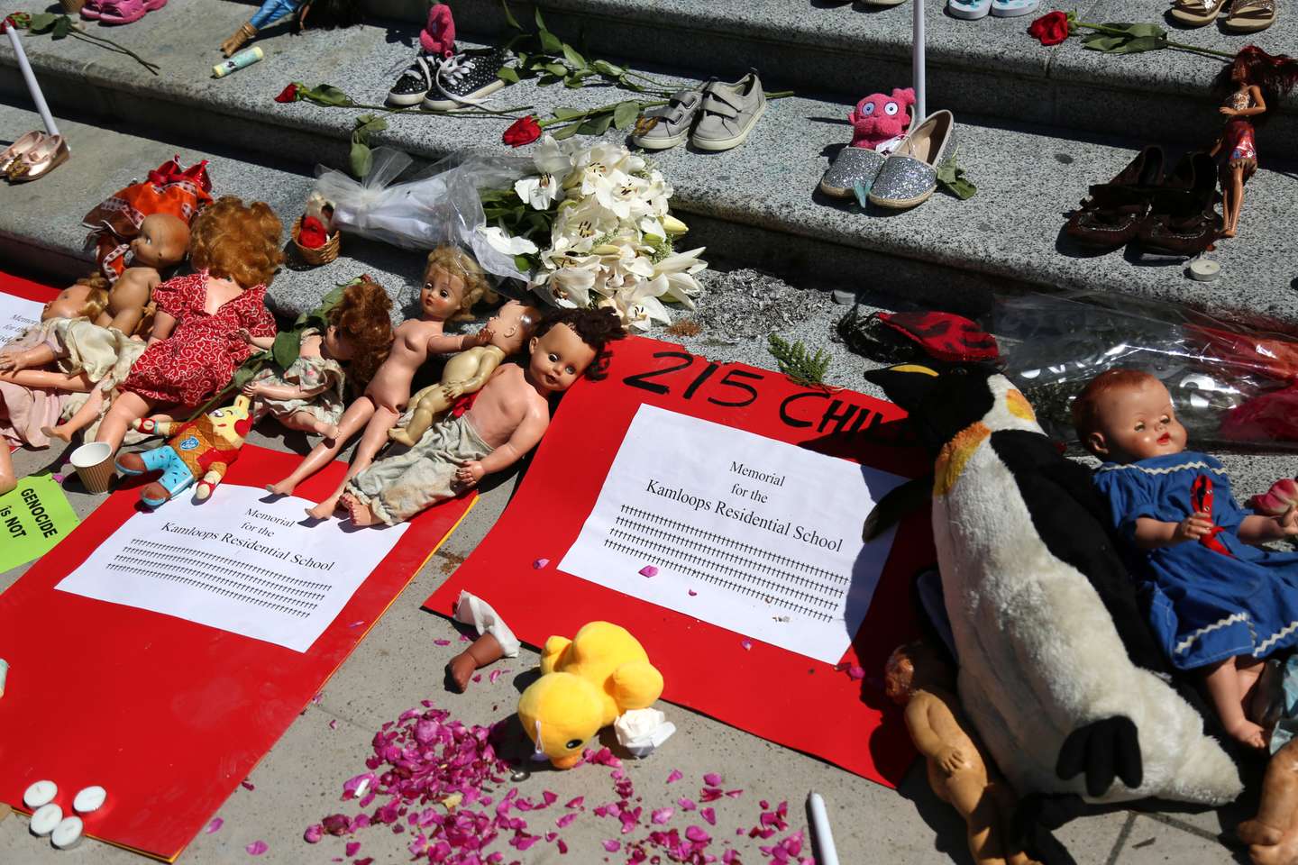 215 pairs of children's shoes set up in Vancouver as tribute after residential school discovery