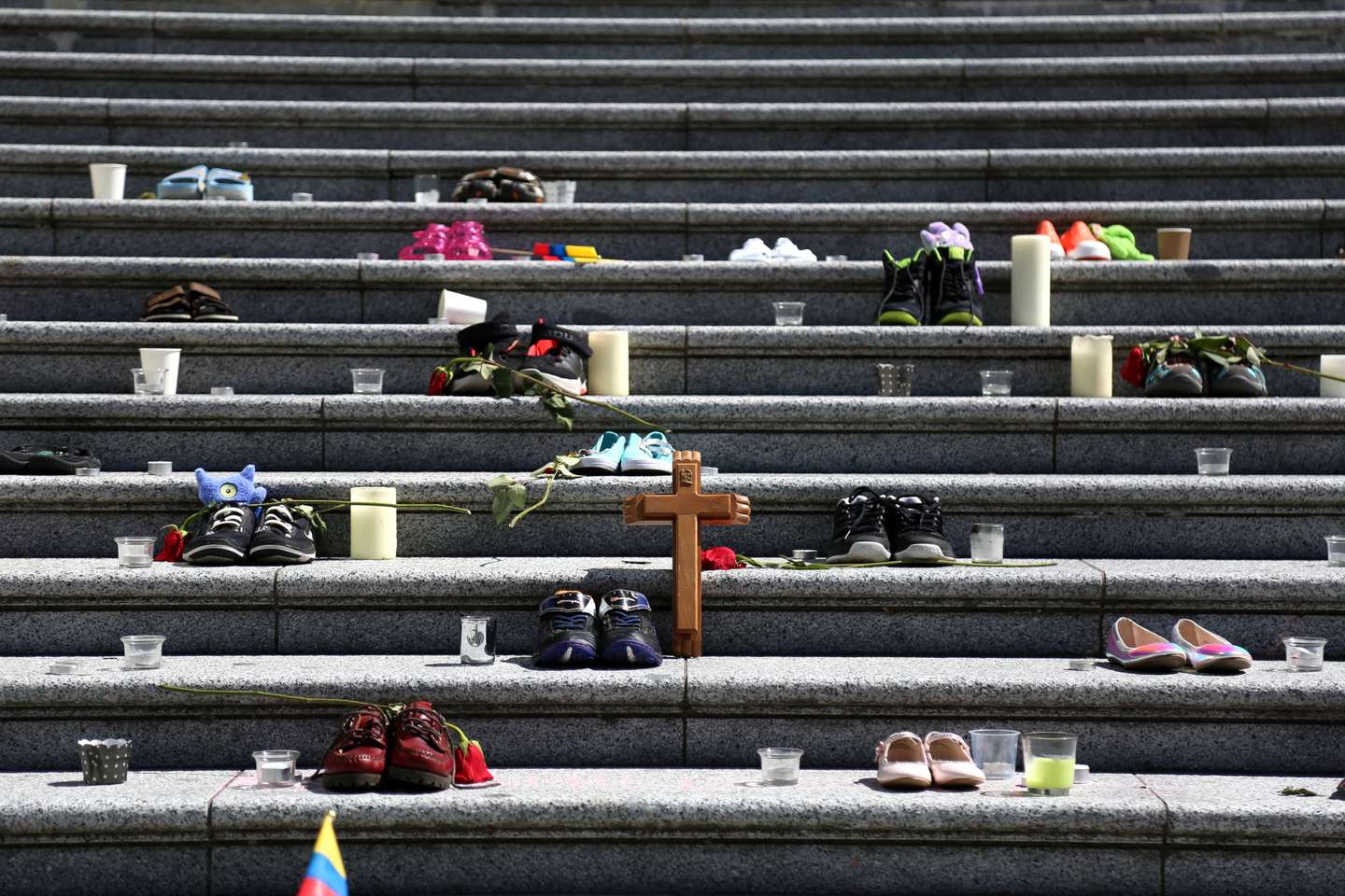 215 pairs of children's shoes set up in Vancouver as tribute after residential school discovery