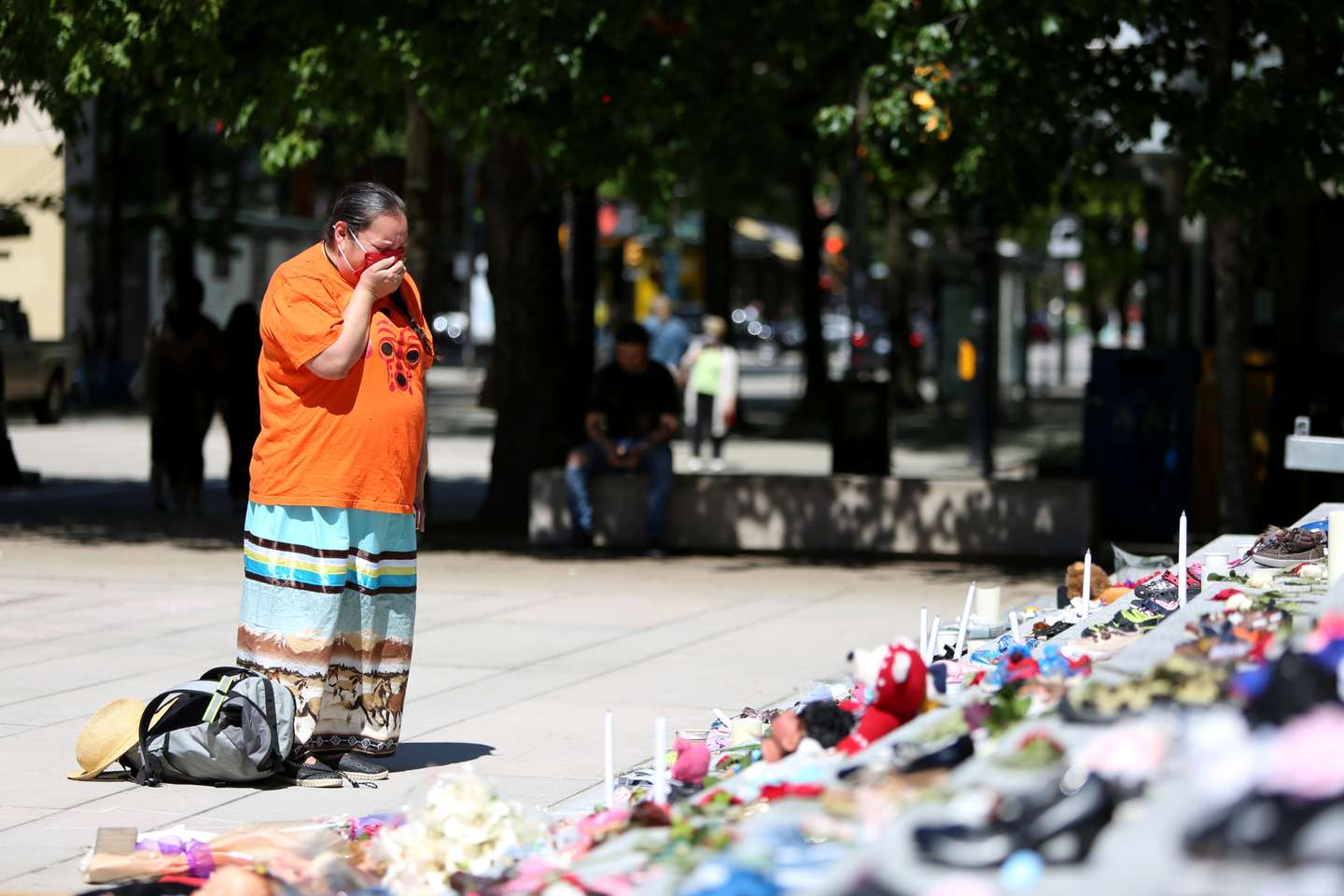 215 pairs of children's shoes set up in Vancouver as tribute after residential school discovery