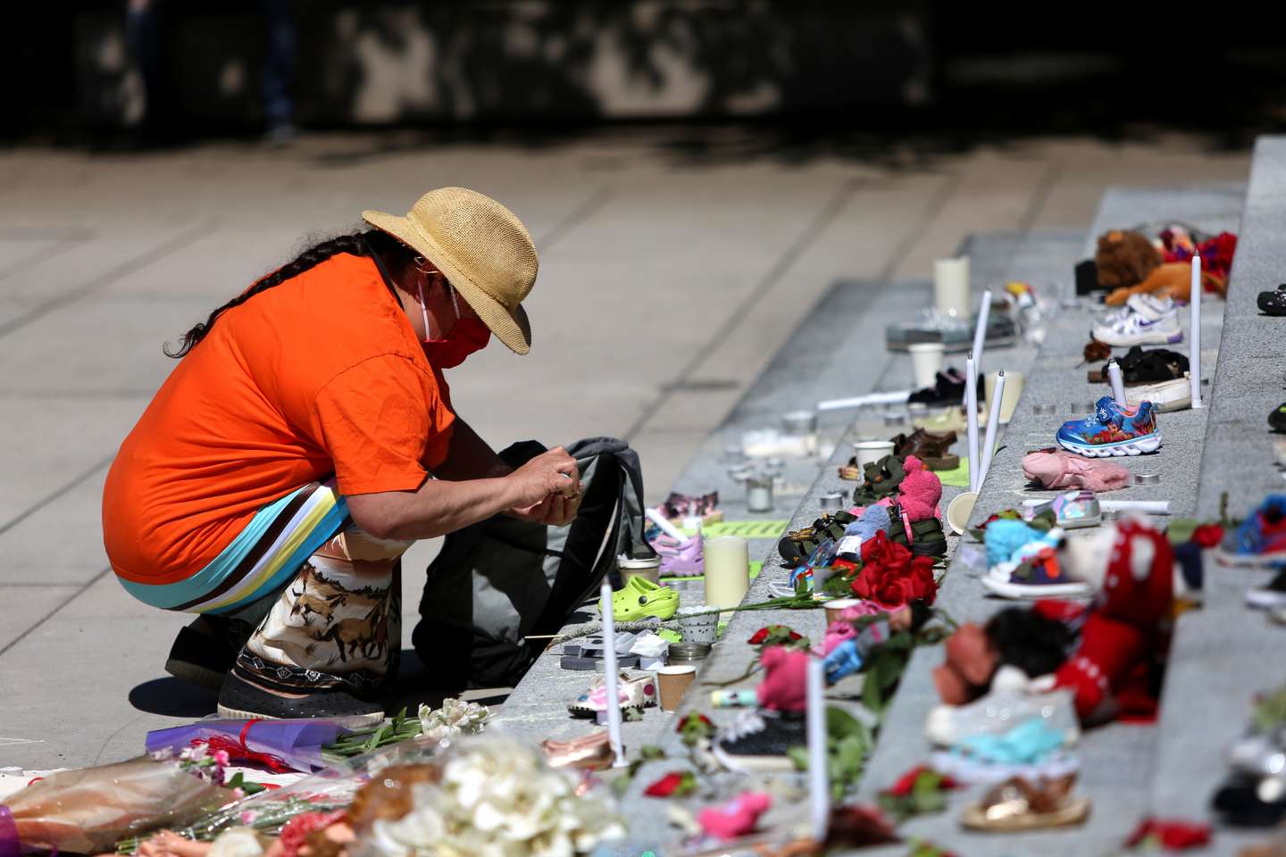 215 pairs of children's shoes set up in Vancouver as tribute after residential school discovery