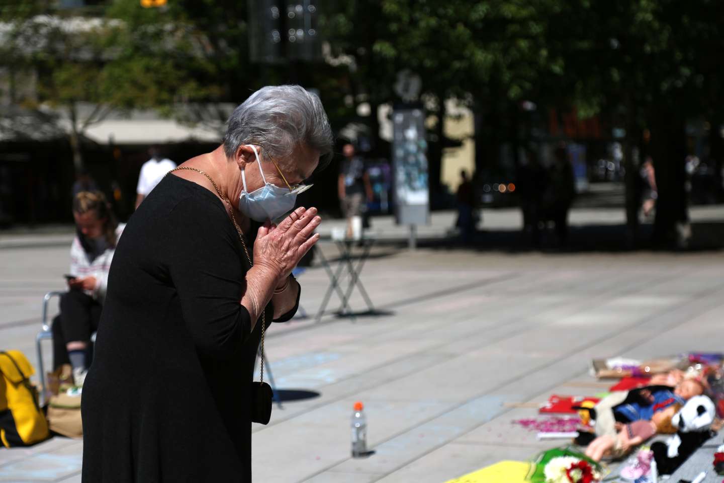 215 pairs of children's shoes set up in Vancouver as tribute after residential school discovery