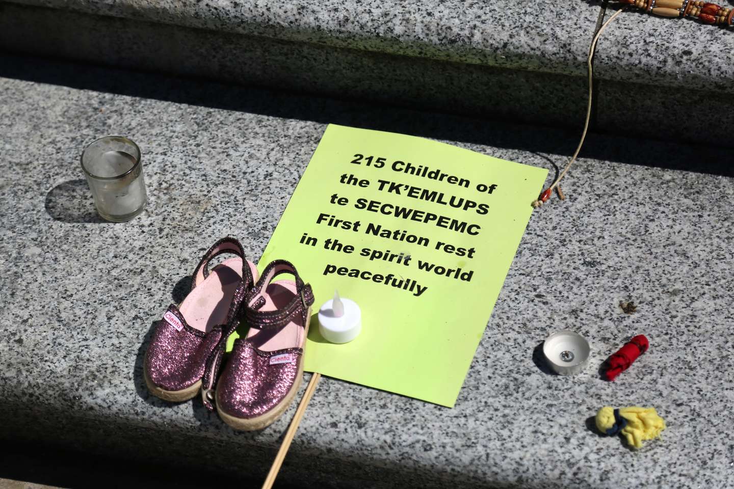 215 pairs of children's shoes set up in Vancouver as tribute after residential school discovery