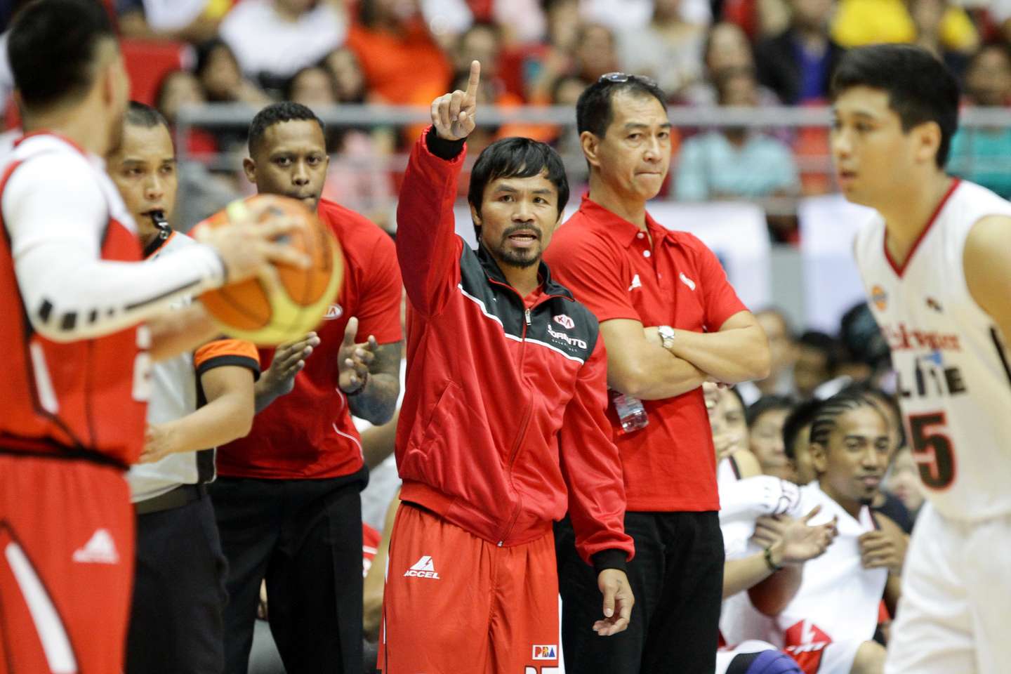 Manny Pacquiao head coach of Kia signals to his players in