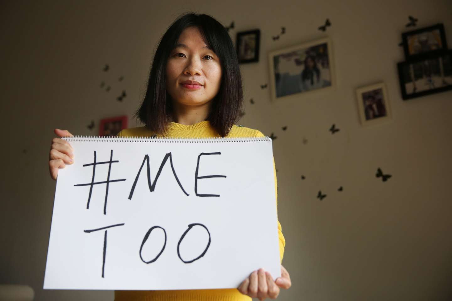 Sophia Huang Xueqin, a freelance journalist who wants to raise peopleé??s awareness on sexual harassment in China, poses with a #MeToo sign at her home. 08DEC17 SCMP/Thomas Yau