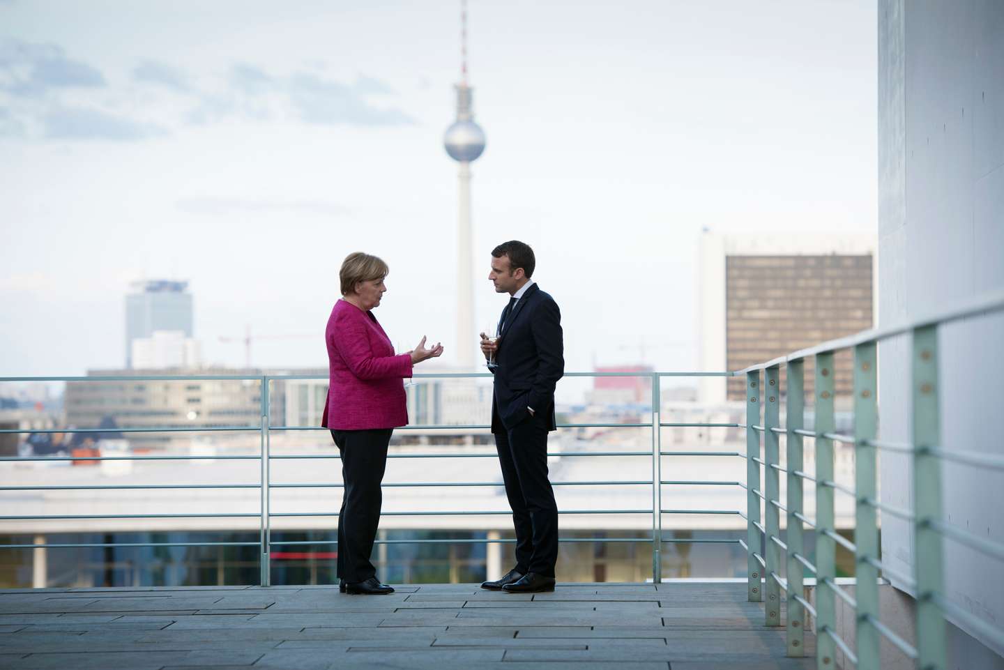 French President Emmanuel Macron Meets Angela Merkel In Berlin