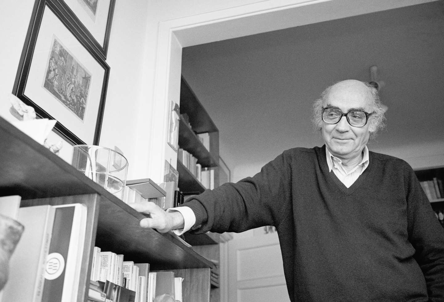 Writer Jose Saramago Leaning on Bookshelf
