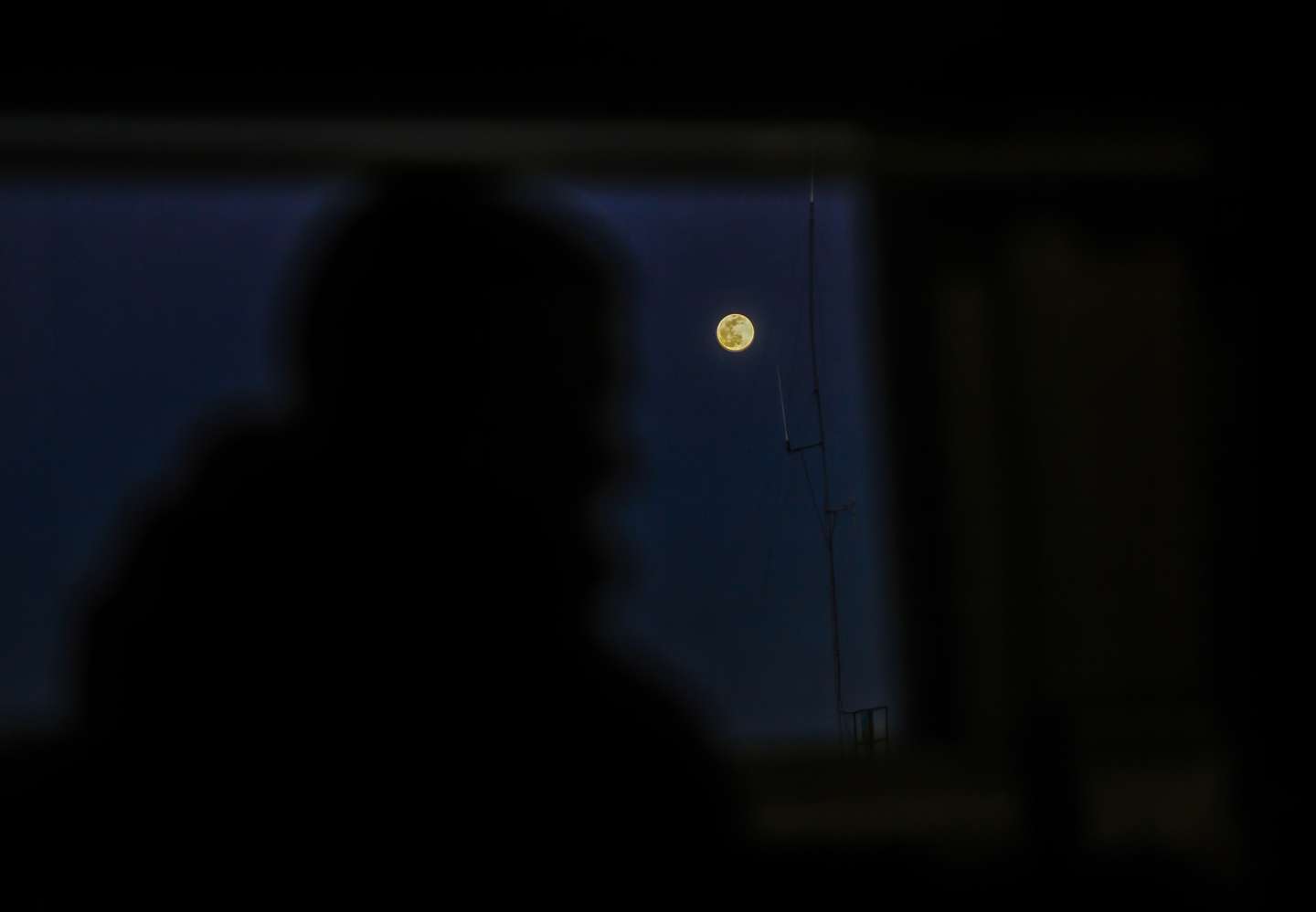 A wolf full moon is seen rising over Gaza City