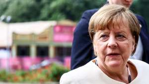 epa11362294 Former German Chancellor Angela Merkel arrives to attend an ecumenical service in St. Mary's Church on the occasion of the 75th anniversary of the proclamation of the Basic Law, in Berlin, German, 23 May 2024. Germany marks the 75th anniversary of its Constitution. The Federal Republic of Germany was founded with the signing of the Basic Law in May 1949.  EPA/Filip Singer
