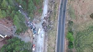 epa10468783 A handout photo made available by Noticias Chiricanas shows the bus that fell from a cliff in the Gualaca area, western Panama, 15 February 2023. At least 39 people died and more than 20 were injured after a bus carrying migrants in transit across the isthmus, from the temporary immigration reception stations in Darien, the border with Colombia, suffered an accident on the way to the Los Planes de Gualaca, in the province of Chiriqui, bordering with Costa Rica.  EPA/NOTICIAS CHIRICANAS/HANDOUT ONLY AVAILABLE TO ILLUSTRATE THE ACCOMPANYING STORY MANDATORYCREDIT BEST QUALITY AVAILABLE HANDOUT EDITORIAL USE ONLY/NO SALES