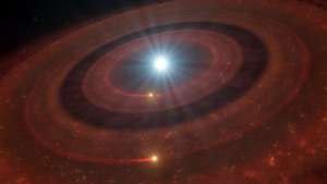 Imagem artística do disco de restos em torno da anã branca J1328−1450
