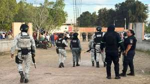 epa12681620 Members of the Mexican National Guard guard the area where an armed attack took place in the city of Salamanca, Mexico, 25 January 2026. At least 11 people were killed and 12 more were injured after an armed attack during a soccer match in the community of Loma de Flores, in the Mexican municipality of Salamanca, Guanajuato state, western Mexico.  EPA/STRINGER
