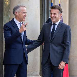 epa13033269 French President Emmanuel Macron (R) welcomes Canadian Prime Minister Mark Carney (L) upon his arrival at the Elysee Palace in Paris, France, 12 June 2026.  EPA/CHRISTOPHE PETIT TESSON