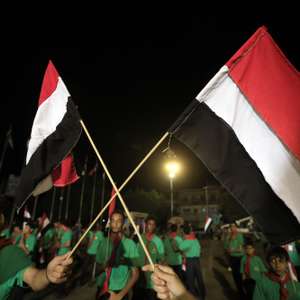 epa13253219 Scout members hold Yemeni flags during a ceremony marking the 12th anniversary of the Houthis' takeover of northern Yemen, in Sanaa, Yemen, 20 September 2026. The Houthis marked the 12th anniversary of their takeover of the capital, Sanaa, and much of northern Yemen, which prompted Saudi Arabia to intervene militarily in an effort to restore the internationally recognized government to power, sparking a prolonged conflict.  EPA/YAHYA ARHAB
