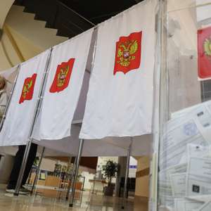 epa13252880 A woman casts her ballot during voting at a polling station in Podolsk, Moscow region, Russia, 20 September 2026. Voting in the State Duma elections is taking place over three days from 18 to 20 September.  EPA/MAXIM SHIPENKOV
