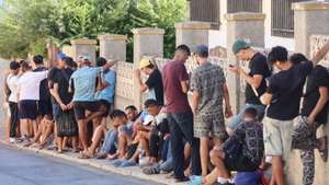 epa13184145 Migrants gathered at a stree in Ceuta, Spain, 22 August 2026. The Spanish government is providing temporary shelter for 1,200 migrants sleeping rough on Trampolin Beach and in the Loma Colmenar area of Ceuta, and plans to gradually expand these facilities.  EPA/REDUAN