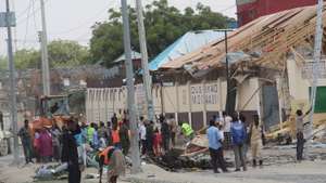 epa09602036 General view at the scene of a car bomb blast in Mogadishu, Somalia, 25 November 2021. According to Somalia Police officials, an explosion occurred near a school, killing at least eight people during rush hour. Radical Islamist group Al-Shabab has claimed responsibility for the blast. According to the police 17 people have been injured, including 13 children.  EPA/SAID YUSUF WARSAME