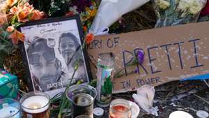 epa12681006 Flowers, candles and photographs are left at a makeshift memorial for Alex Pretti in south Minneapolis, Minnesota, USA, 25 January 2026. Pretti, a 37-year-old intensive care unit (ICU) nurse, was fatally shot by US Border Patrol agents on 24 January. Local leaders have condemned the shooting and called for the withdrawal of federal forces, while the Department of Homeland Security maintained that agents acted in self-defense during a struggle with an armed individual.  EPA/CRAIG LASSIG
