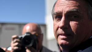 epa10704195 Former president of Brazil, Jair Bolsonaro, leaves the Federal Senate after visiting his son Senator Flavio Bolsonaro at the National Congress in Brasilia, Brazil 21 June 2023. The Superior Electoral Court (TSE) will begin a trial on 22 June for alleged abuses of power by former Brazilian President Jair Bolsonaro, who may lose all his political rights if found guilty.  EPA/Andre Borges