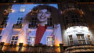 epa12587923 (FILE) - A picture of the 2023 Nobel Peace Prize winner Narges Mohammadi is projected on the facade of the Grand Hotel before the Nobel Banquet in Oslo, Norway, 10 December 2023 (reissued 12 December 2025). Narges Mohammadi, Nobel Peace Prize laureate in 2023, was arrested by security forces during a memorial ceremony for late lawyer Khosrow Alikordi, according to verified reports, citing the Narges Foundation.  EPA/Javad Parsa / POOL NORWAY OUT