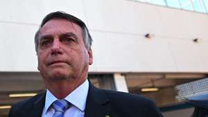 epa10926182 Former Brazilian president Jair Bolsonaro leaves the Federal Police headquarters after testifying in the case of several businessmen who allegedly supported the 2023 Brazilian Congress attack, in Brasilia, Brazil, 18 October 2023. The parliamentary commission on the 08 January 2023 coup attempt in Brazil began debating its final report, which accuses Bolsonaro of having conspired to try to overthrow the Government of progressive Luiz Inacio Lula da Silva.  EPA/Andre Borges