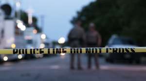 epa09974533 Police and investigators continue to work at the scene of a mass shooting at the Robb Elementary School which killed 19 children and two adults according to Texas Governor Greg Abbott in Uvalde, Texas, USA, 25 May 2022. The eighteen-year-old gunman was killed by responding officers.  EPA/AARON M. SPRECHER