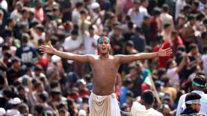 epa11528465 A Bangladeshi man chants on a street as people gather in Dhaka, Bangladesh, 05 August 2024. In an address to the nation, Chief of Army Staff General Waker-Uz-Zaman announced that Prime Minister Sheikh Hasina has resigned after weeks of unrest and an interim government will be formed to run the country. Dhaka authorities have imposed a new curfew starting 06:00 p.m. local time on 04 August. As casualties mounted and law enforcement struggled to contain the unrest, the Bangladeshi government on 20 July 2024 had imposed an initial nationwide curfew and deployed military forces after violence broke out in Dhaka and other regions following student-led protests demanding reforms to the government&#039;s job quota system.  EPA/MONIRUL ALAM