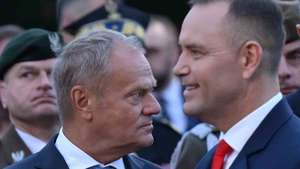epa13203885 Polish President Karol Nawrocki (R) and Prime Minister Donald Tusk (L) attend a commemoration ceremony marking the 87th anniversary of the outbreak of World War II at the Monument to the Defenders of the Coast on Westerplatte, Gdansk, Poland, 01 September 2026. World War II began on 01 September 1939 at 4:45 a.m., when the German battleship Schleswig-Holstein opened fire on the Polish military transit depot at Westerplatte.  EPA/ADAM WARZAWA POLAND OUT