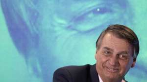 epa10147733 Jair Bolsonaro, current president of Brazil and candidate of the Liberal Party (PL), participates in the debate 'Dialogue with Presidential candidates of the Republic', promoted by the National Union of Entities of Trade and Services (UNECS), in Brasilia, Brazil, 30 August 2022. The elections in Brazil will be held next 02 October and if no candidate obtains 50 percent of the valid votes, a second round will be held on 30 October 2022.  EPA/Joedson Alves