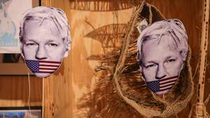 epa10568708 Cutouts of WikiLeaks founder Julian Assange during a protest to mark the fourth anniversary of his detention in Thamesmead South-East London Belmarsh prison, in Brussels, Belgium, 11 April 2023. Julian Assange is in his fourth year of imprisonment in Britain whilst the US government tries to extradite him to face charges of espionage.  EPA/OLIVIER MATTHYS
